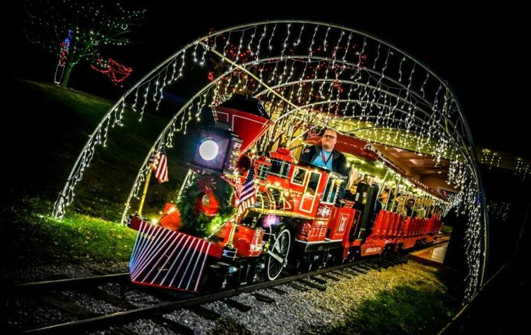 train rides below holiday lights